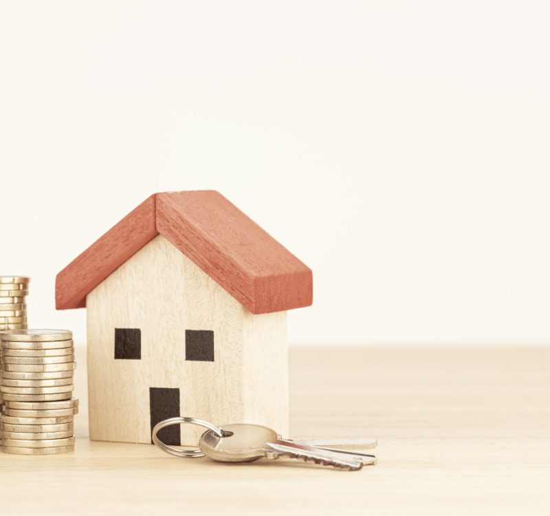 Real estate background. House model, money and keys. Copy space